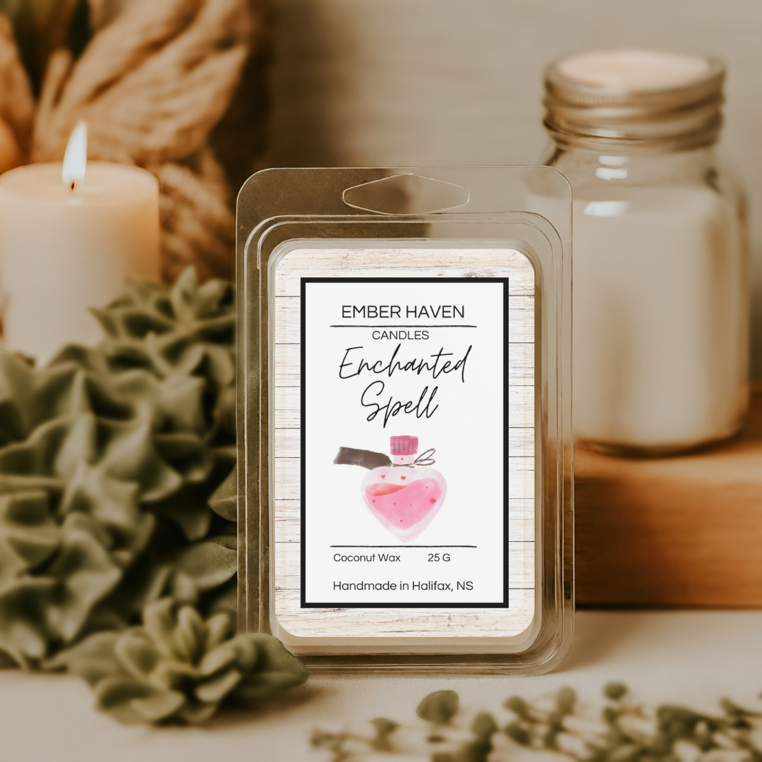 Ember Haven Candles Enchanted Spell wax melt packaging with a candle and jar in the background